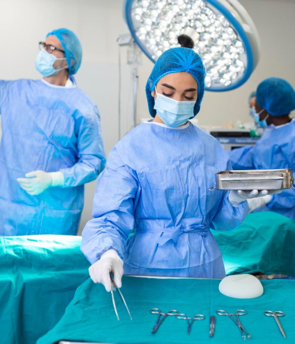 female-surgeon-surgical-uniform-taking-surgical-instruments-operating-room-young-woman-doctor-hospital-operation-theater
